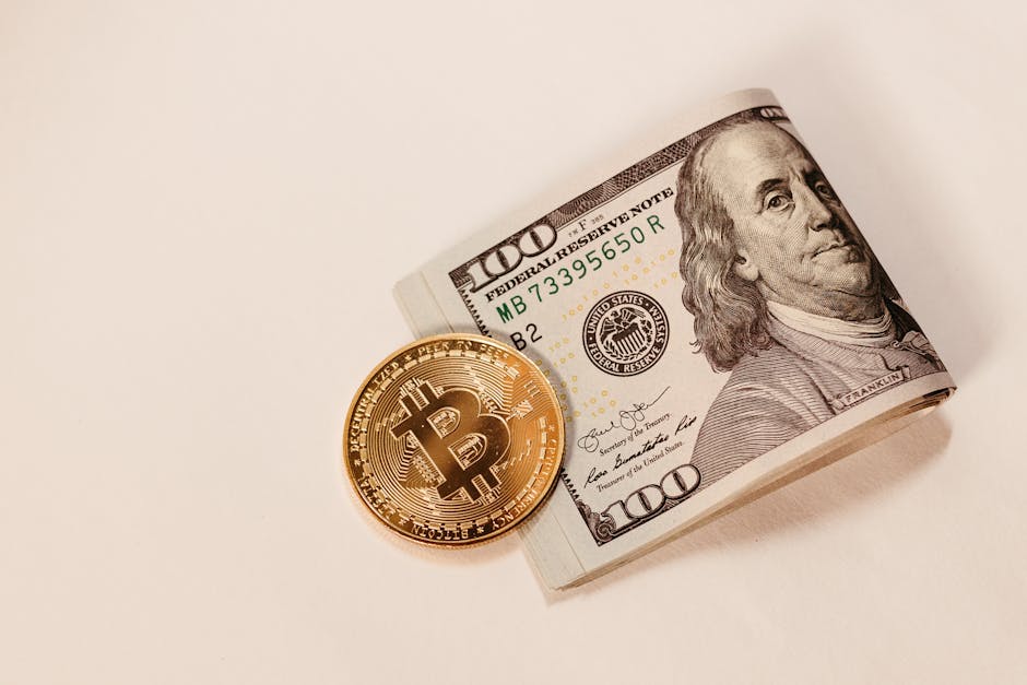 cover-image-276893 Złoty bitcoin leżący obok banknotu stodolarowego, symbolizujący połączenie tradycyjnych i cyfrowych form płatności.